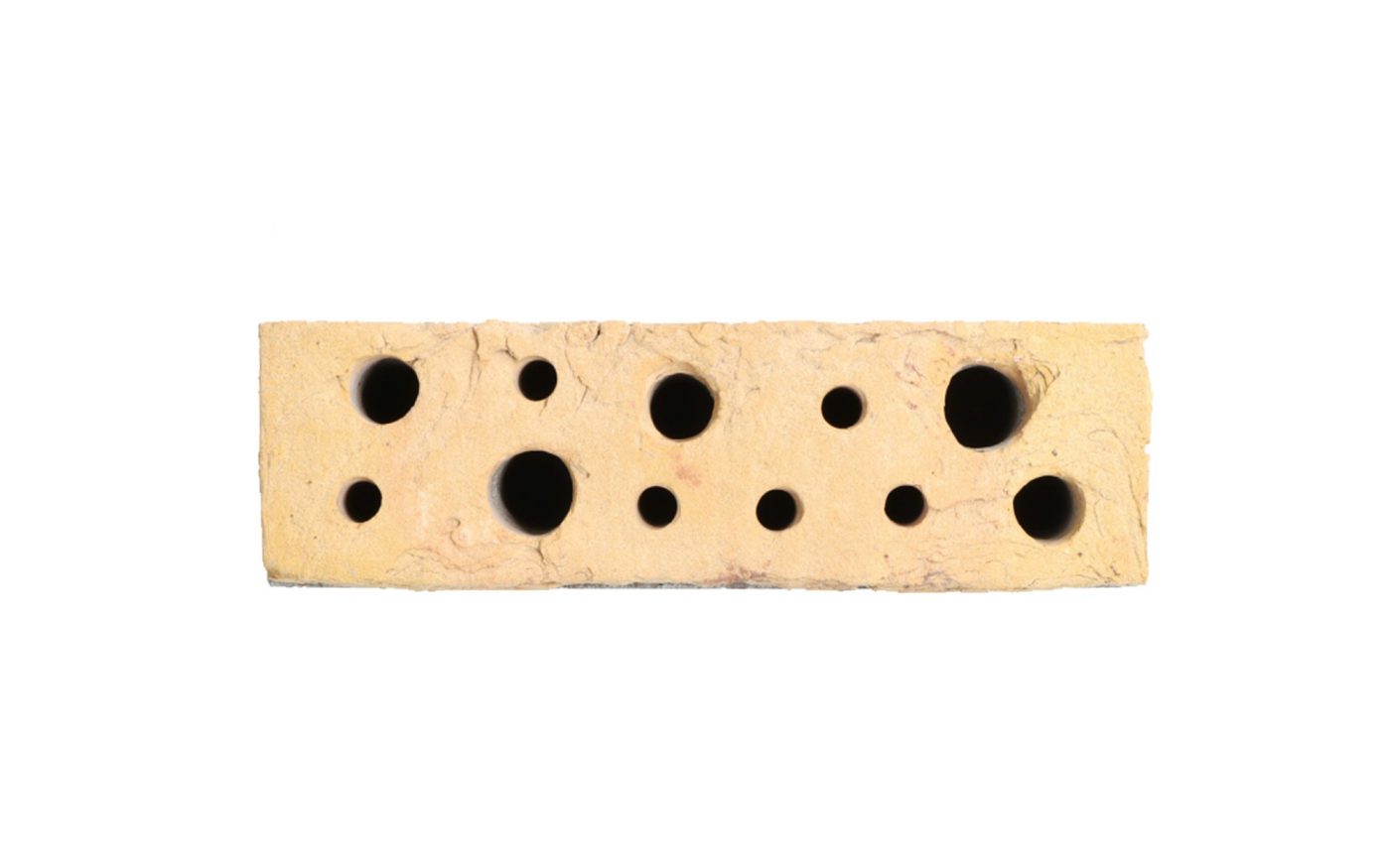 Yellow bee brick with holes drilled