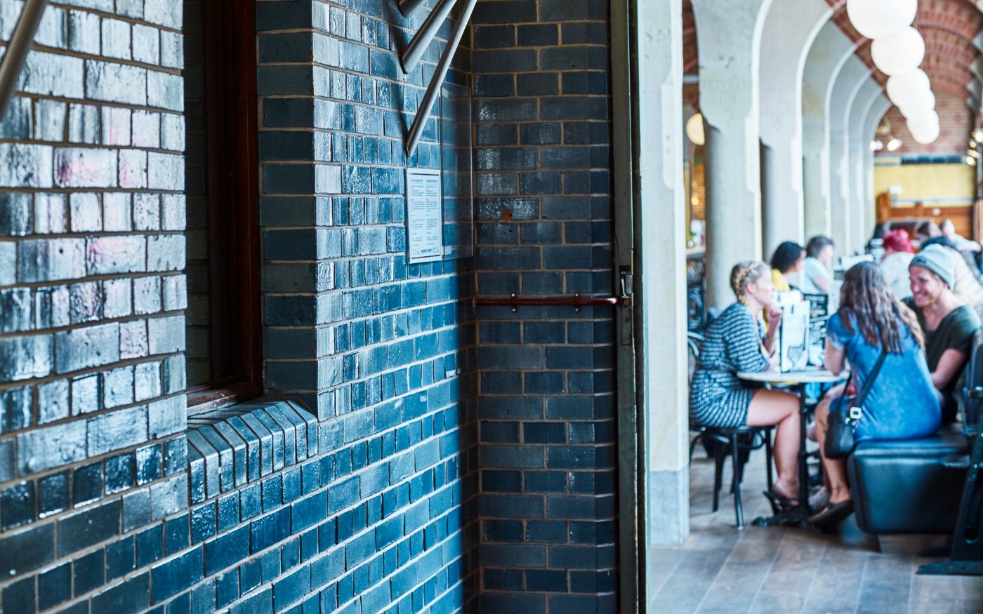 Interior blue glazed brick wall in modern restaurant