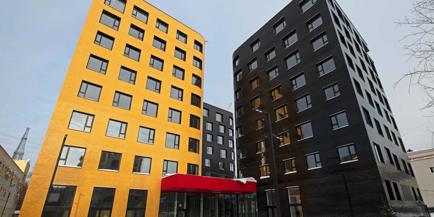 Black and yellow glazed brick hotel