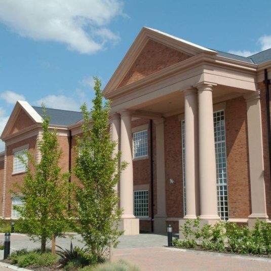 Impressive building with brick exterior and columns