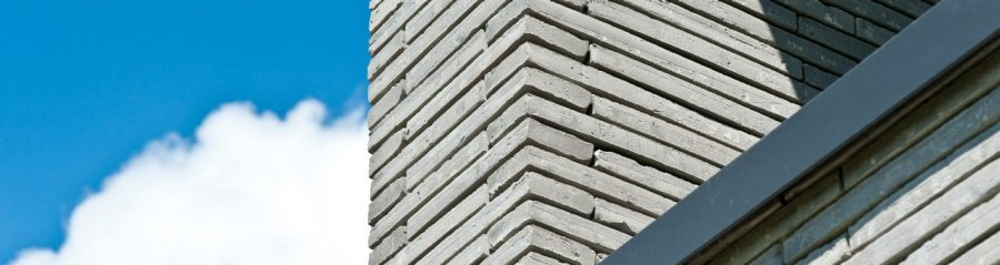 Exterior of building with long format brick facade