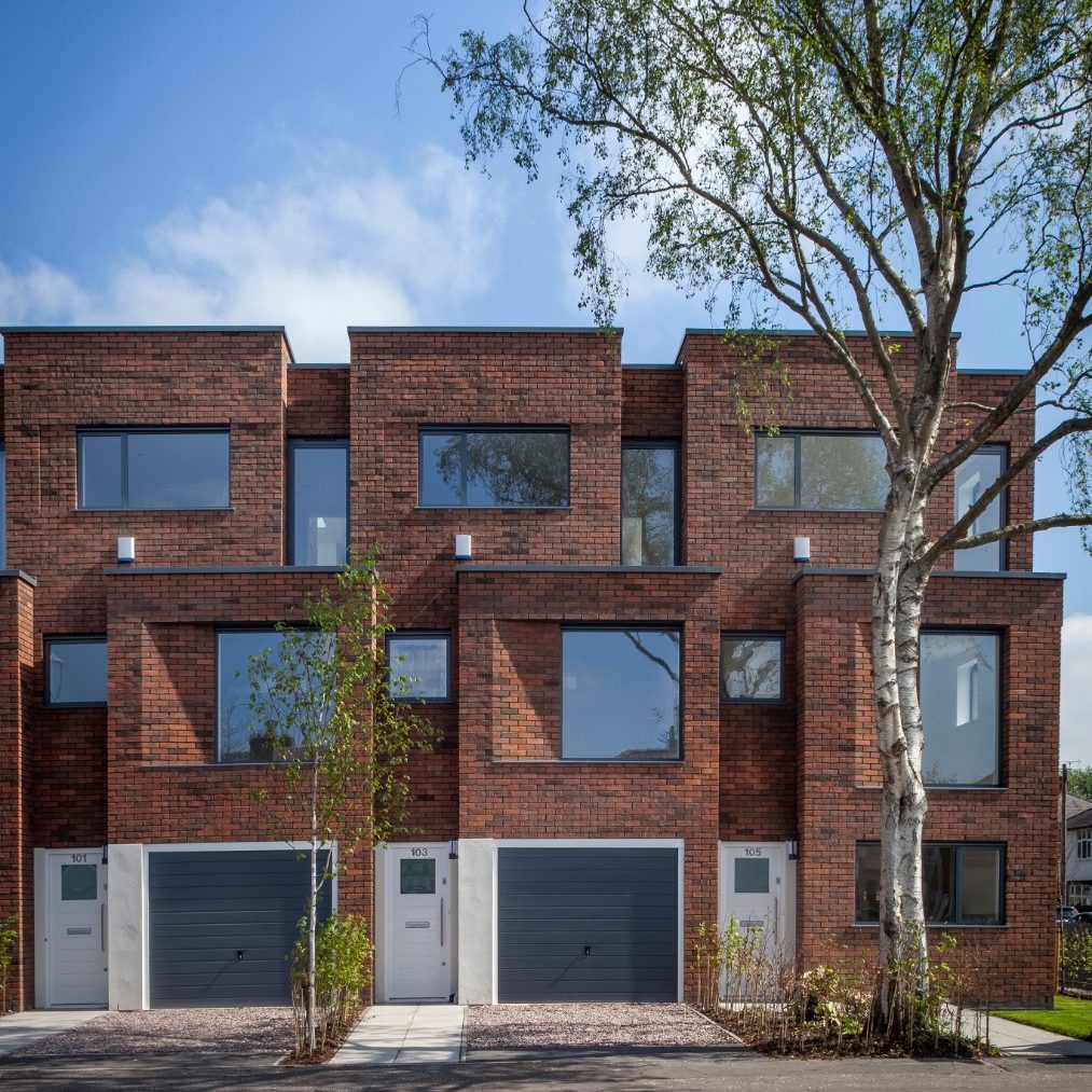 Row of modern red brick terraced houses