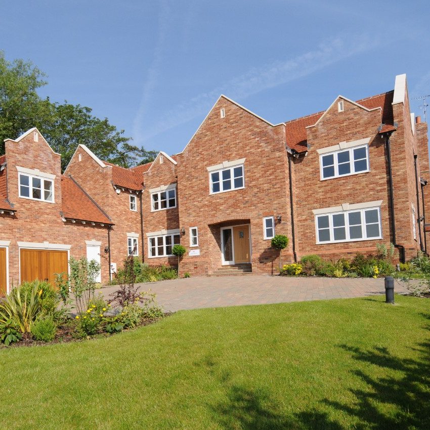 Large traditional house with red facing brick exterior