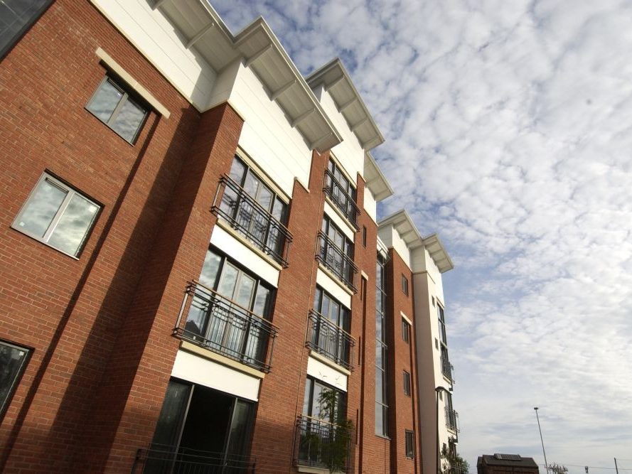Exterior of large apartment building with brick facade