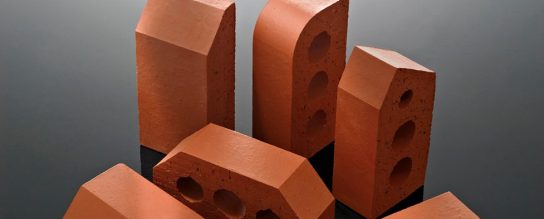 Toy construction vehicles with assortment of special shaped bricks