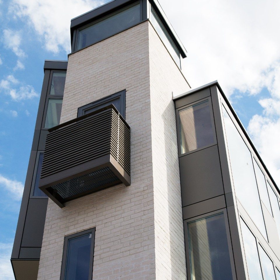 Modern residential building with white brick facade