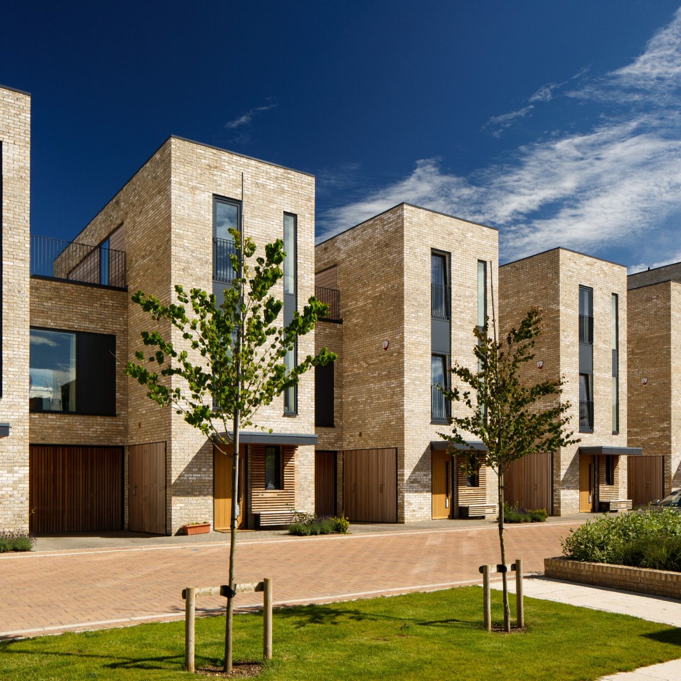 Buff brick modern new residential developments agiaint blue sky