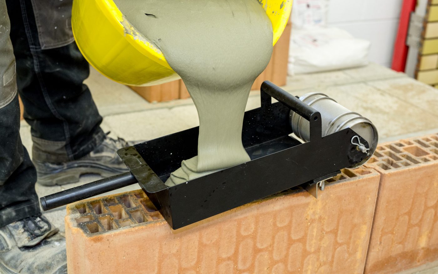 ZeroPlus mortar being poured into a roller