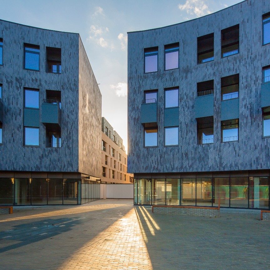 housing development built with Blue Multi with a dark grey mortar using the Corium system offering 145 affordable flats and houses, and 74 for private rent