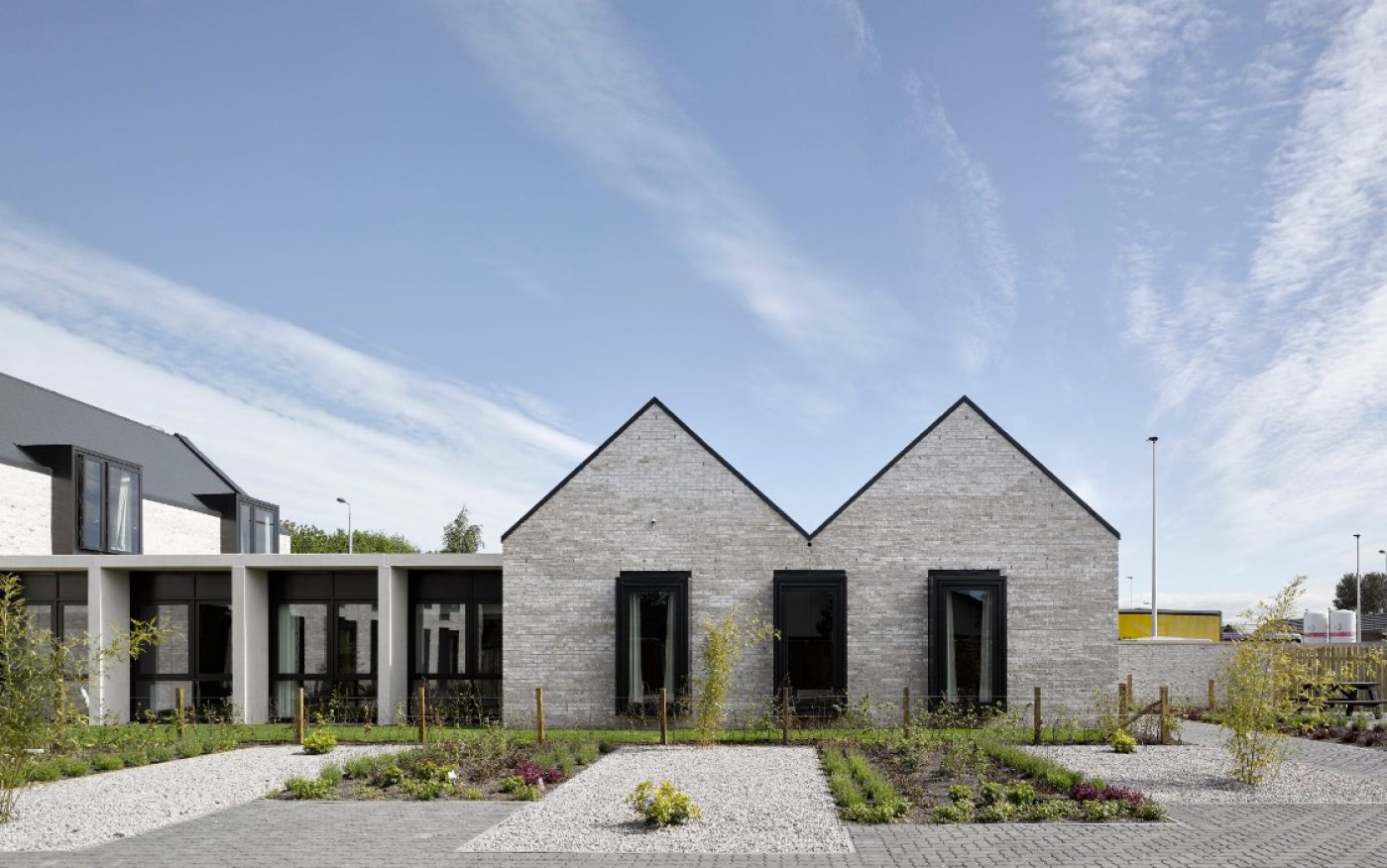 Modern grey brick respite home with landscaped garden