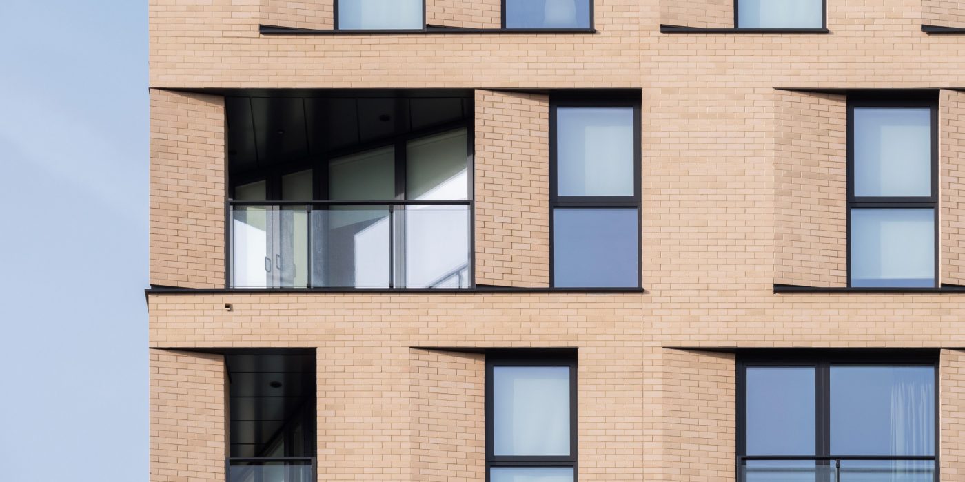 Exterior of modern apartment building with Corium facade