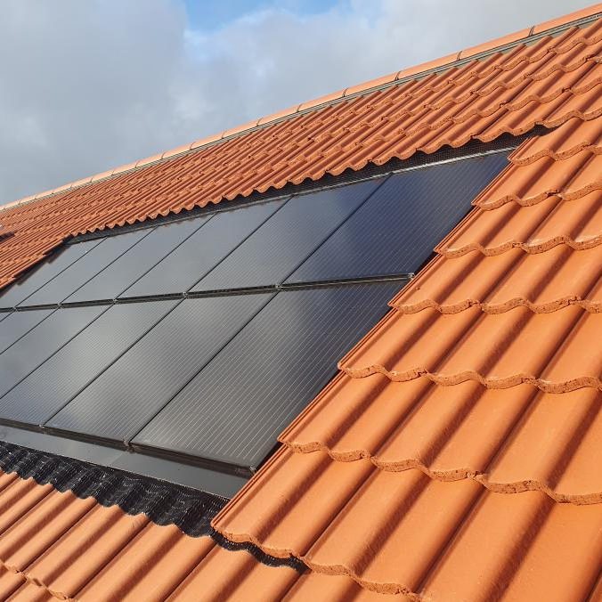 In-roof solar panels on terracotta roof