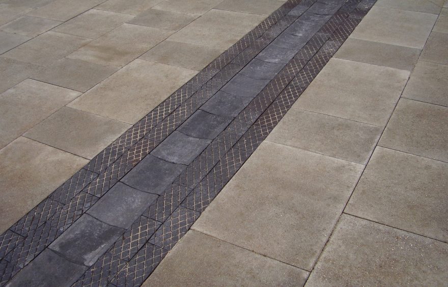 Grey dipped paver to allow water to run off paving