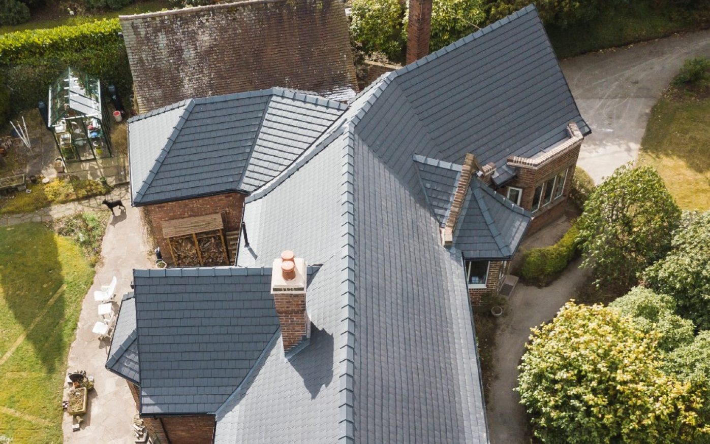 Aerial view of large house with 20/20 Antique Slate roof