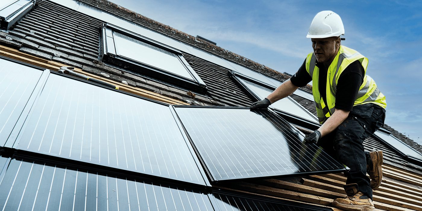 Roofing contractor installing in-roof solar