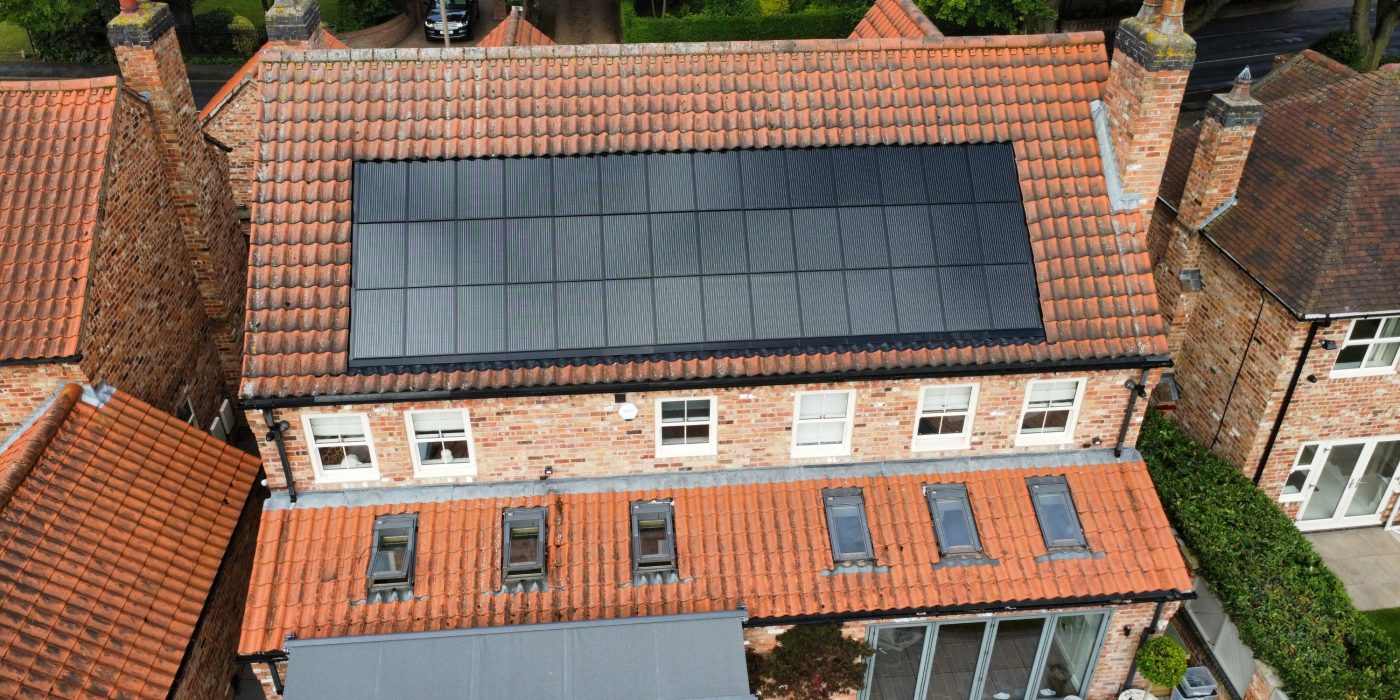 Roofing contractor installing in-roof solar