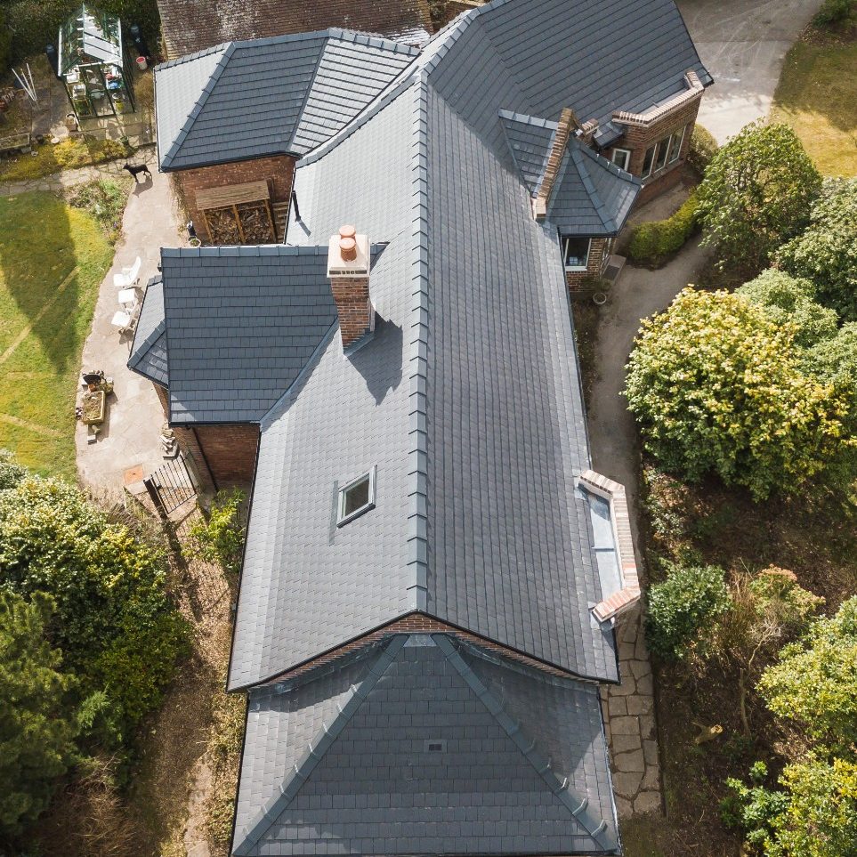 Aerial view of renovated roof of residential building