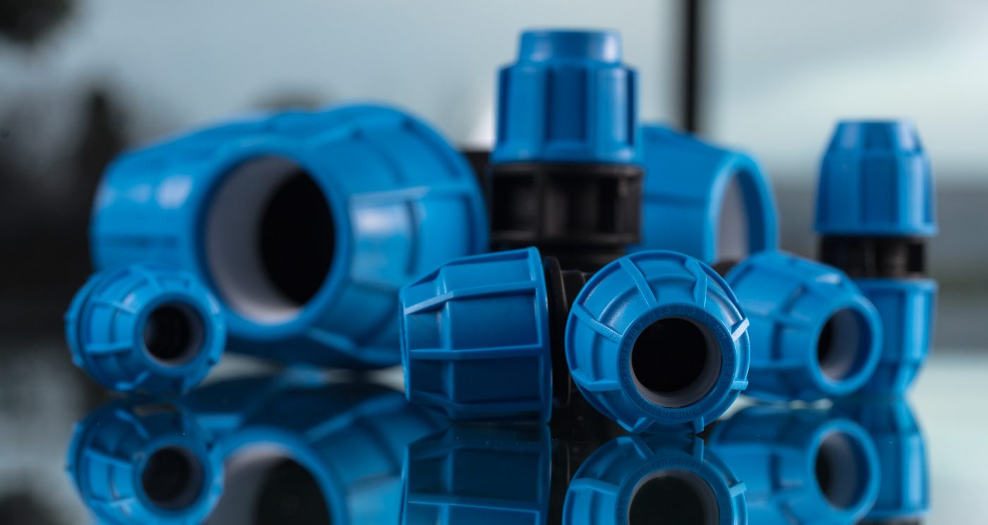 Blue and black MDPE products displayed on mirrored surface
