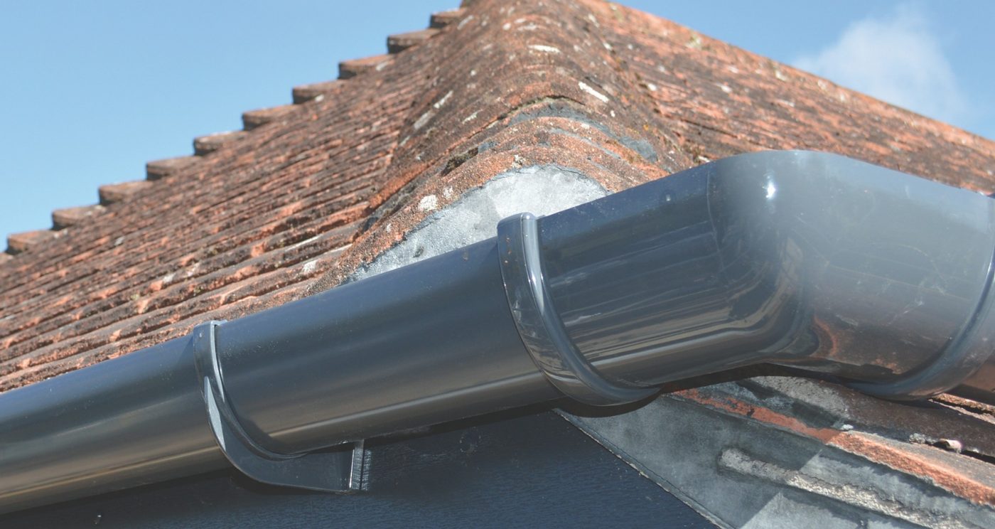 Rainwater guttering system installed onto roofline of home