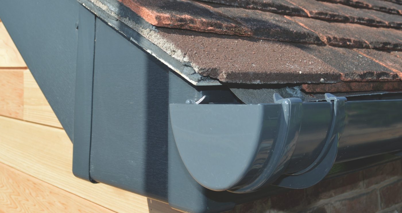 High quality grey PVC-U roofline guttering installed on a roof