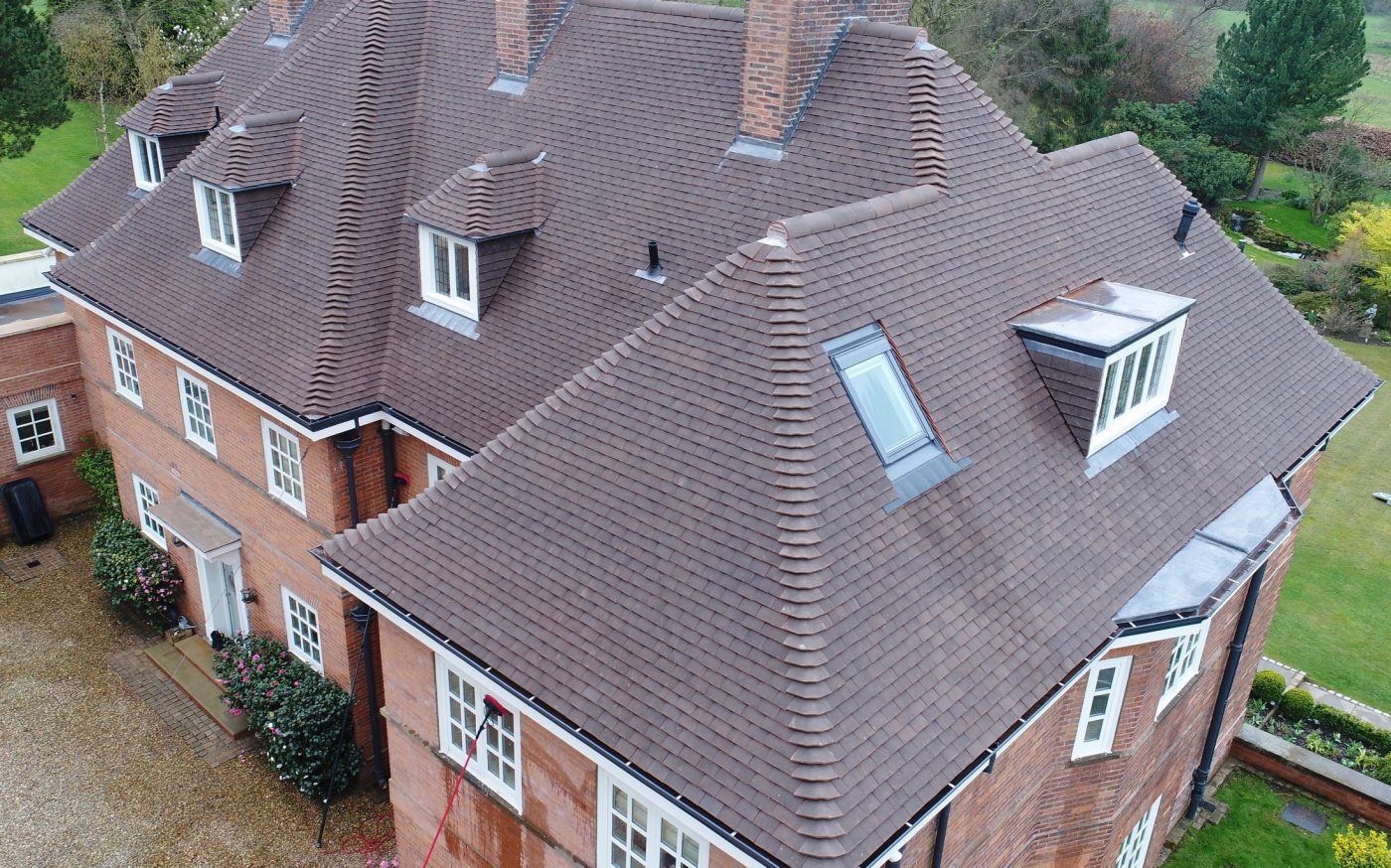 Alderly Brow brick building with Barrow tiles. Windows on the rear of the house, on display.
