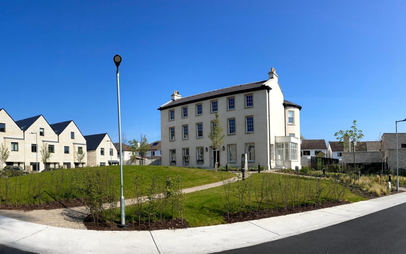 Image of the newly restored Prospect House in Dublin surrounded by newly developed residential builds