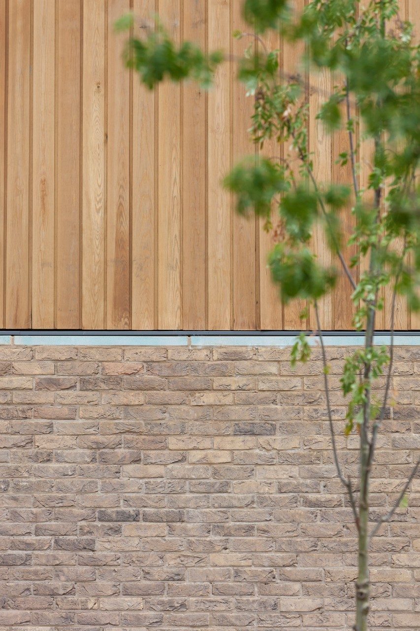 Entrance of Beech House modern house with two storey window