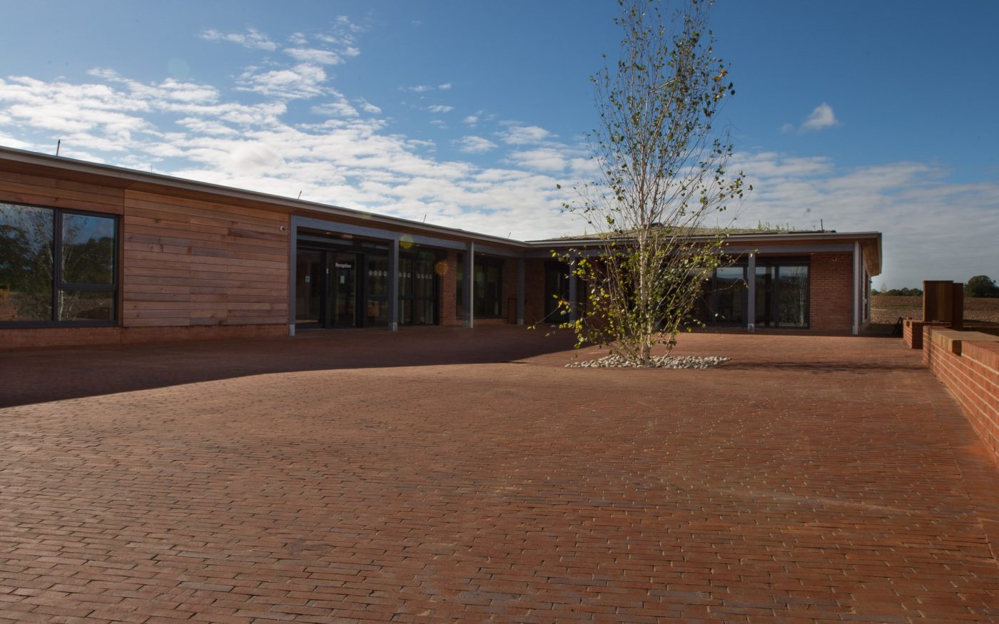 Large area outside the dog centre paved with clay pavers