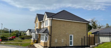 Side profile of detached home on new housing estate
