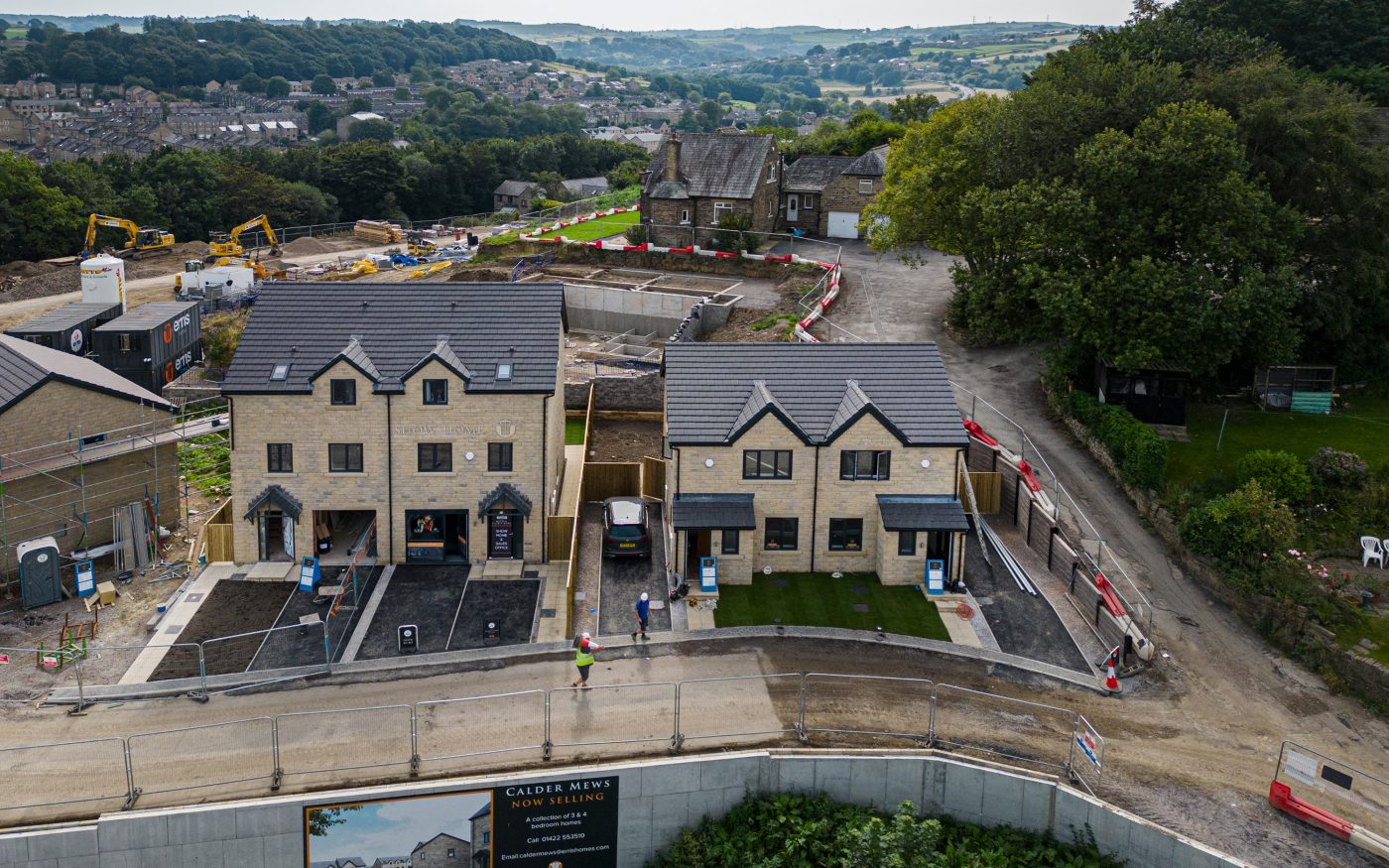 New multistory homes with lovely view in the background