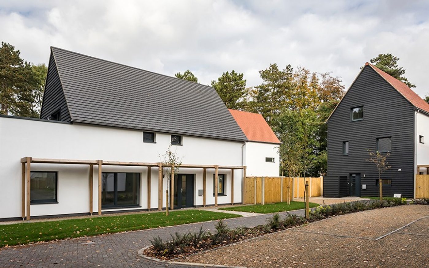 Driveway outside modern homes with grey roof