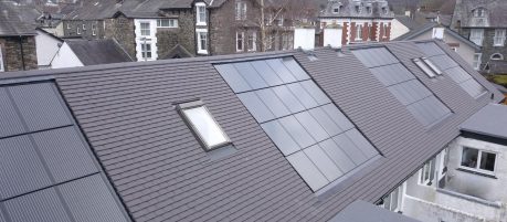 Grey plain roof tiles with in-roof solar included