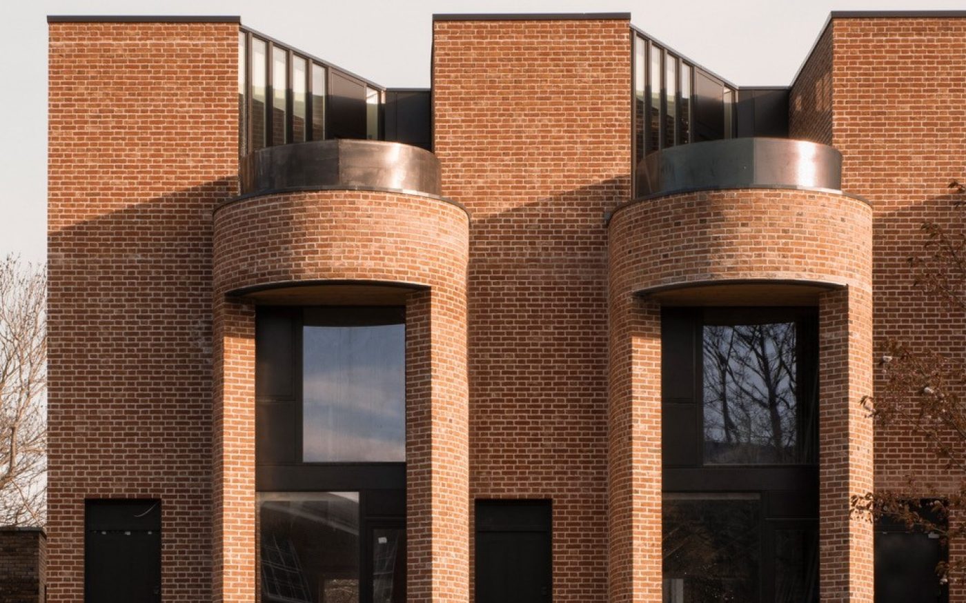 Beautiful and unqiue townhouse design with red brick and big front windows
