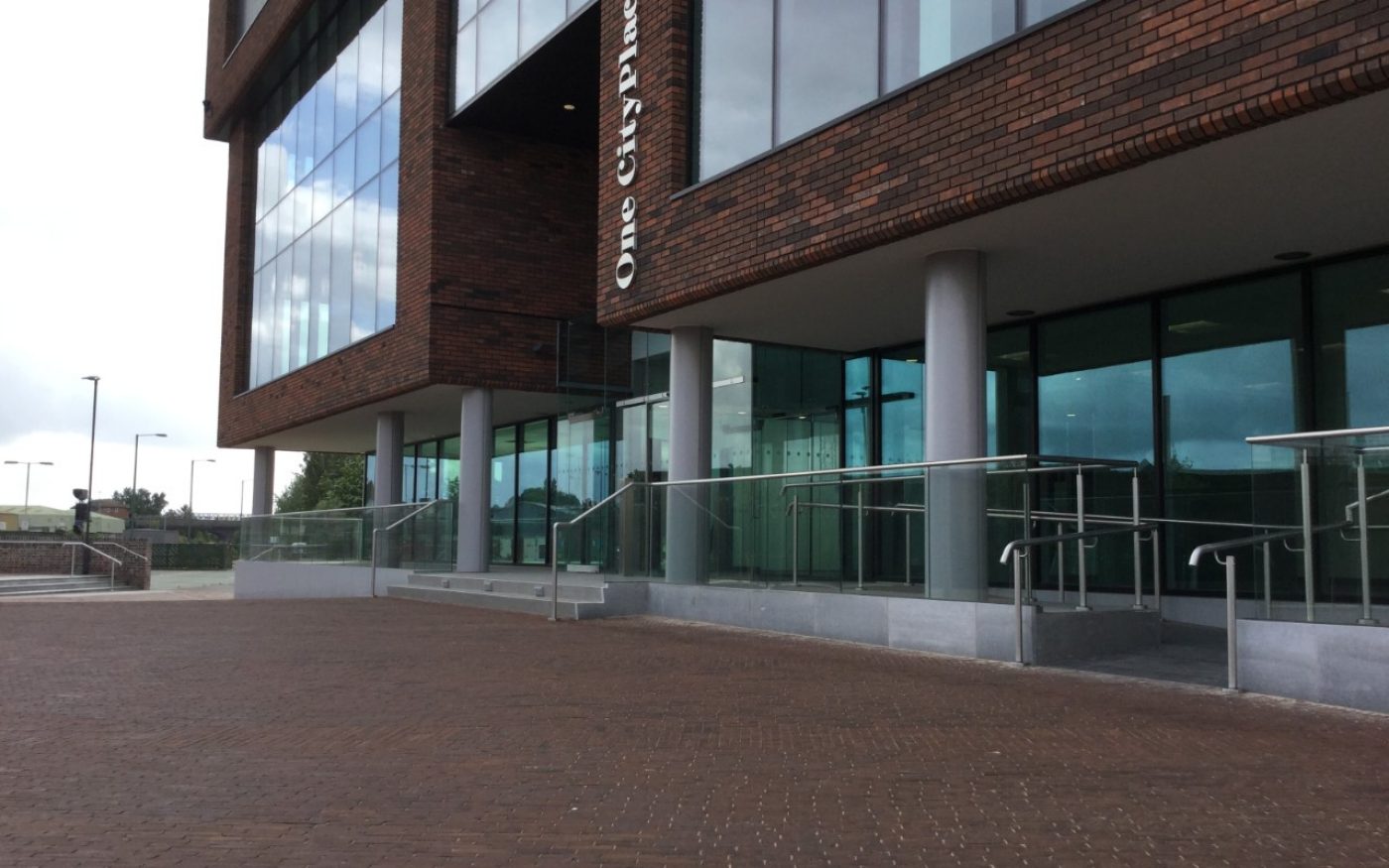 Modern commercial building and clay paved landscaping