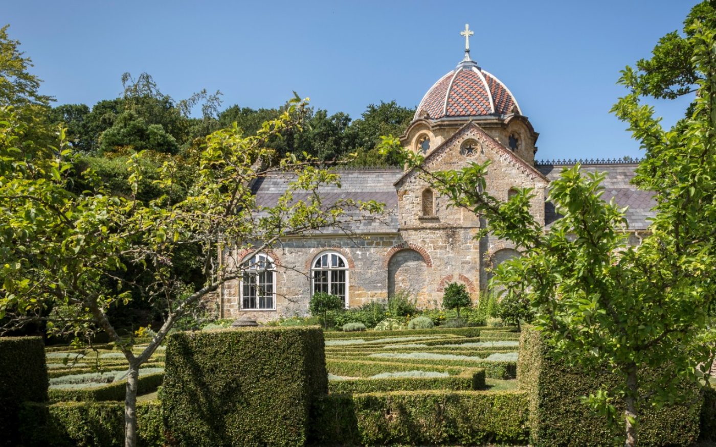 A traditional country garden and old church with domed roof