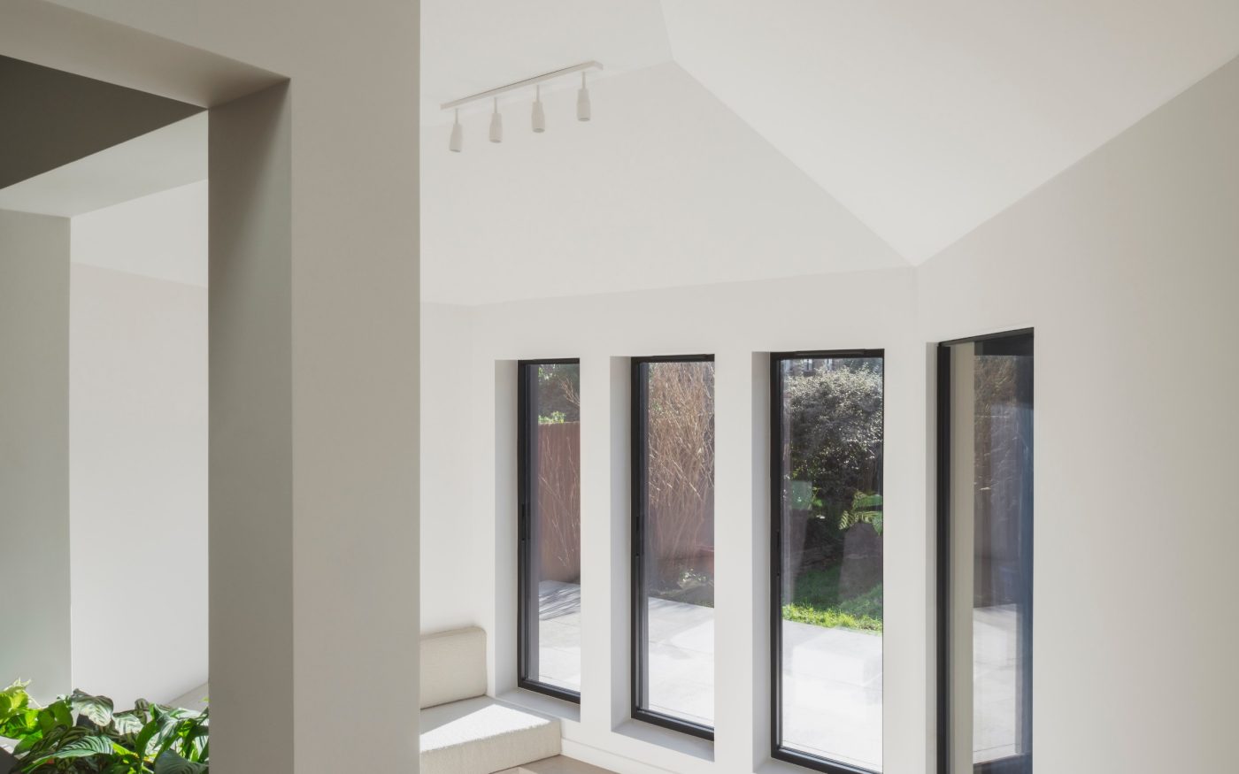 Internal view of the bright modern extension with 4 floor to ceiling windows