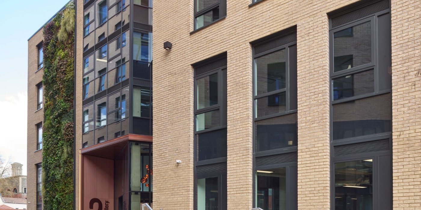 Multi storey buff brick building