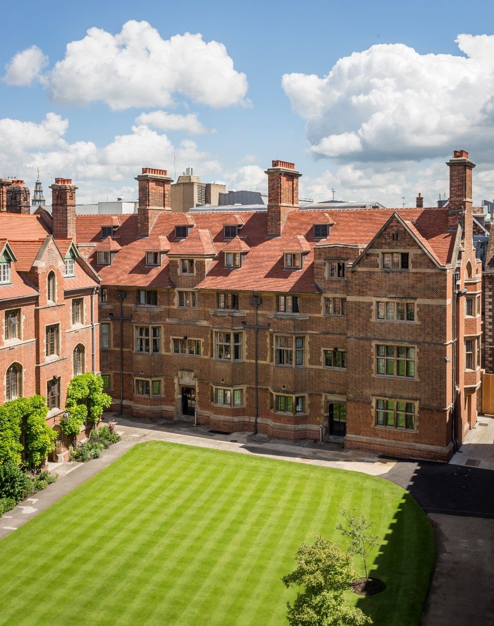 Historic college building and grass quadrangle