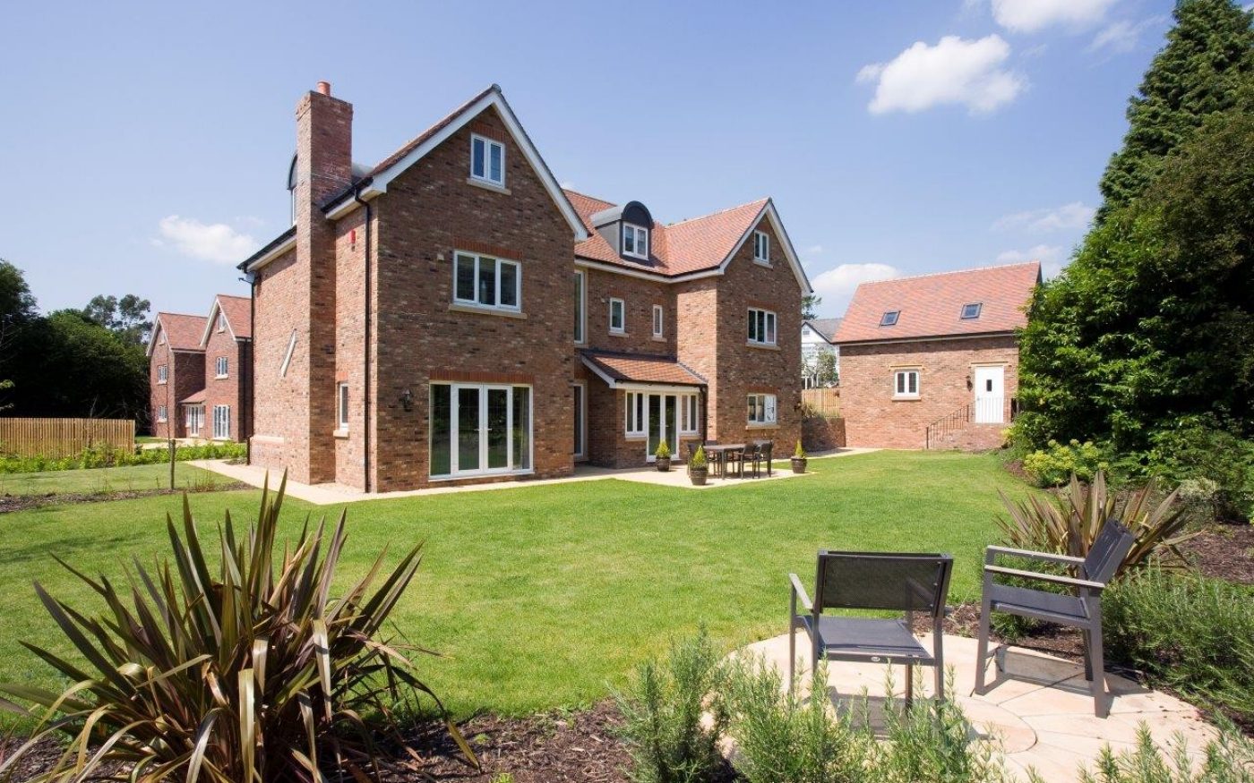 Back garden of large detached modern manor house