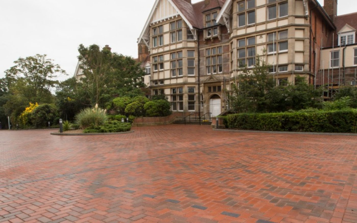 Large paved driveway outside beautiful traditional building
