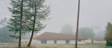 hazy view of the retirement home in the distance with grey sky