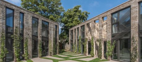 Ultra-modern brick houses with full length windows and asymmetric paving