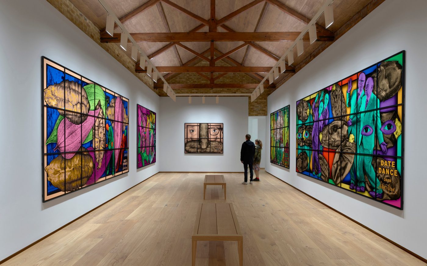 Internal view of the gallery with big colourful artwork on the walls