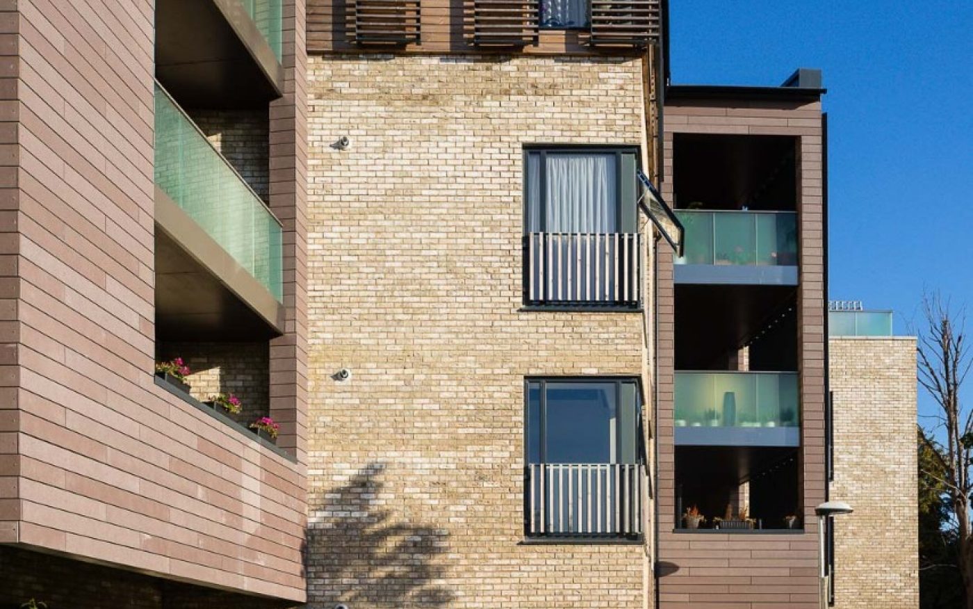 Merging outside and inside in a housing development built in  Marziale brick 