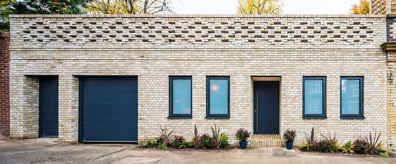 Project using Marziale brick to replace the original external skin of a house with a crafted brick wall that incorporates pattern, brick projection and proportion to create a new decorative facade.