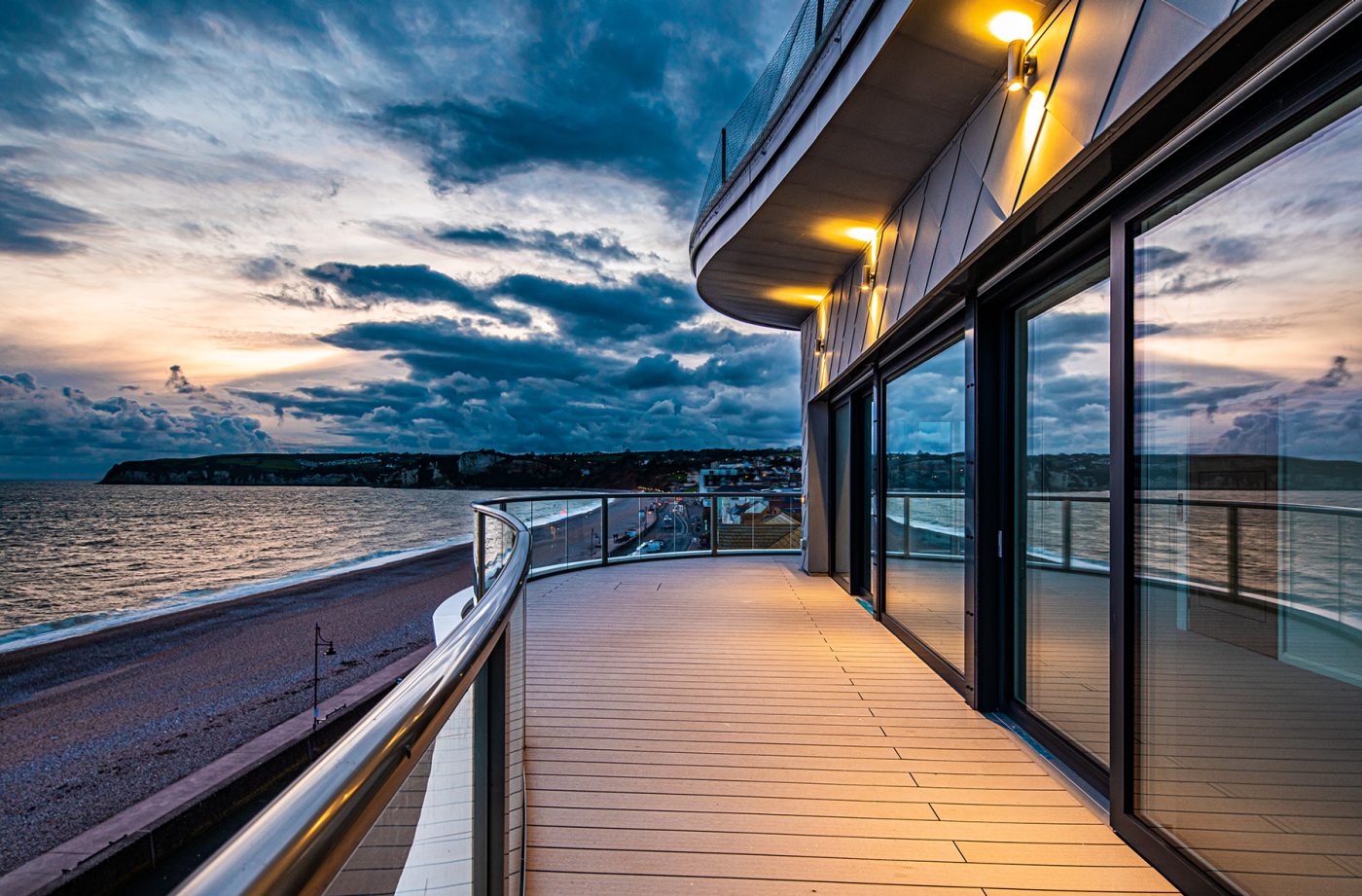 Exterior balcony at sunset on modern apartment building