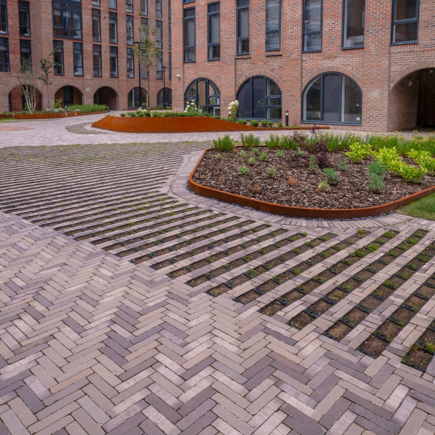 Modern paved path and steps outside multi-storey building