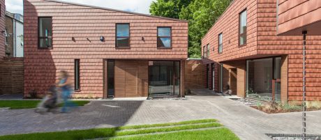 Modern houses with asymmetrical roof and tile cladding walls
