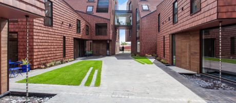 Courtyard of the Kaolin Court project showing the red sandtoft tile cladding