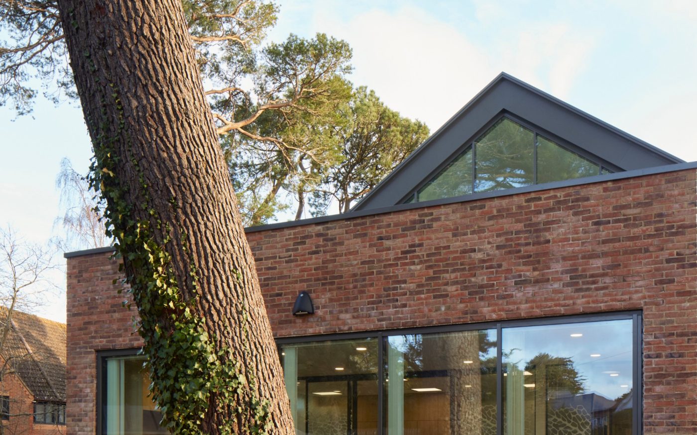 Women sat on a bench outside Kimmeridge Court